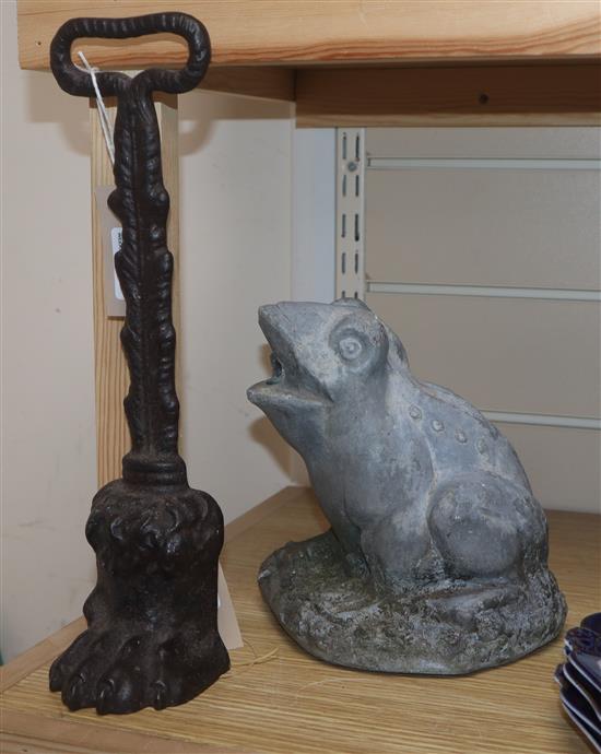 A late Georgian Coalbrookdale cast iron doorstop modelled as a lions paw and a lead frog garden water fountain